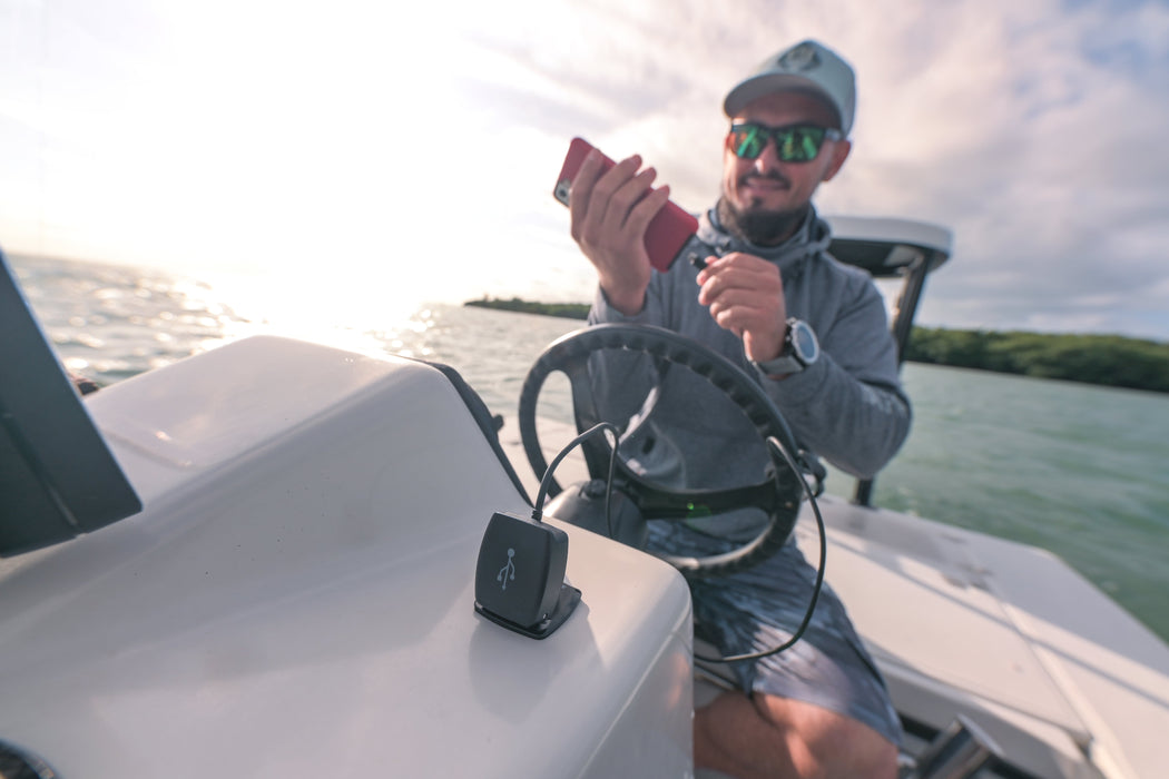 Scanstrut Flip Pro USB Charger SC-USB-F1 USB C Phone plugged in on boat